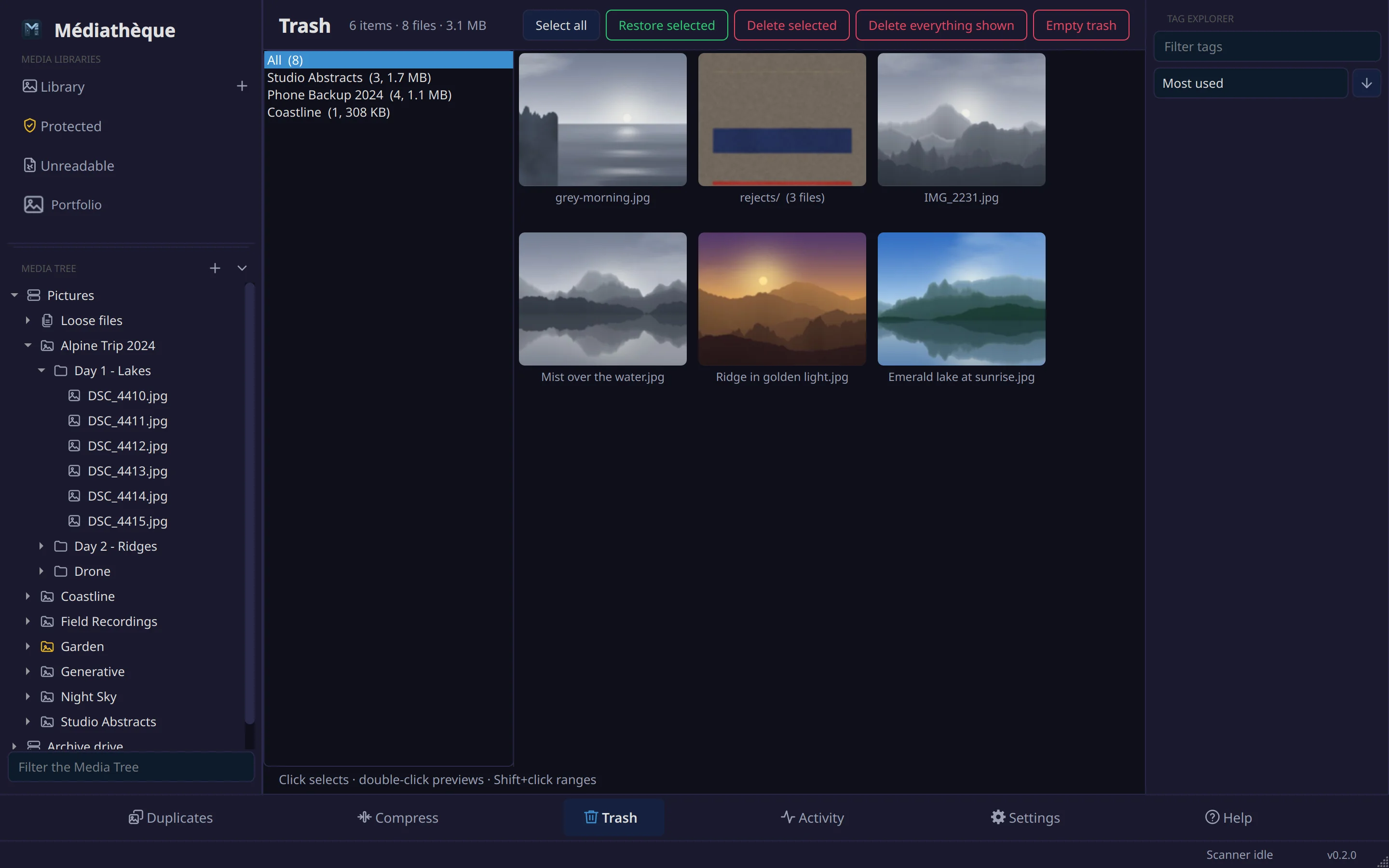 The Trash page: a rail of collections on the left and the trashed files and folders as tiles, with Restore and Delete buttons.