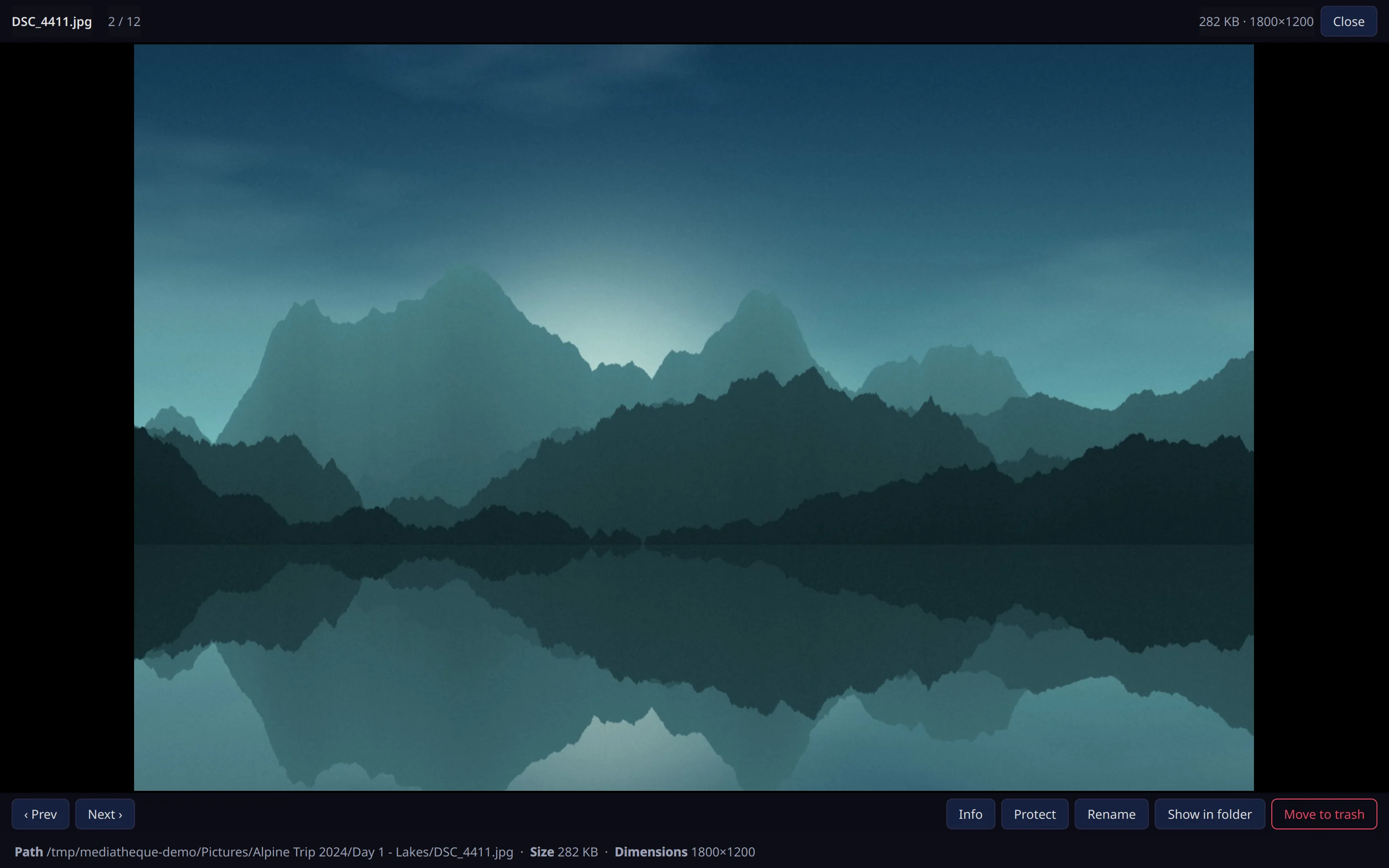 The viewer showing a lake landscape full size with the info line along the bottom.
